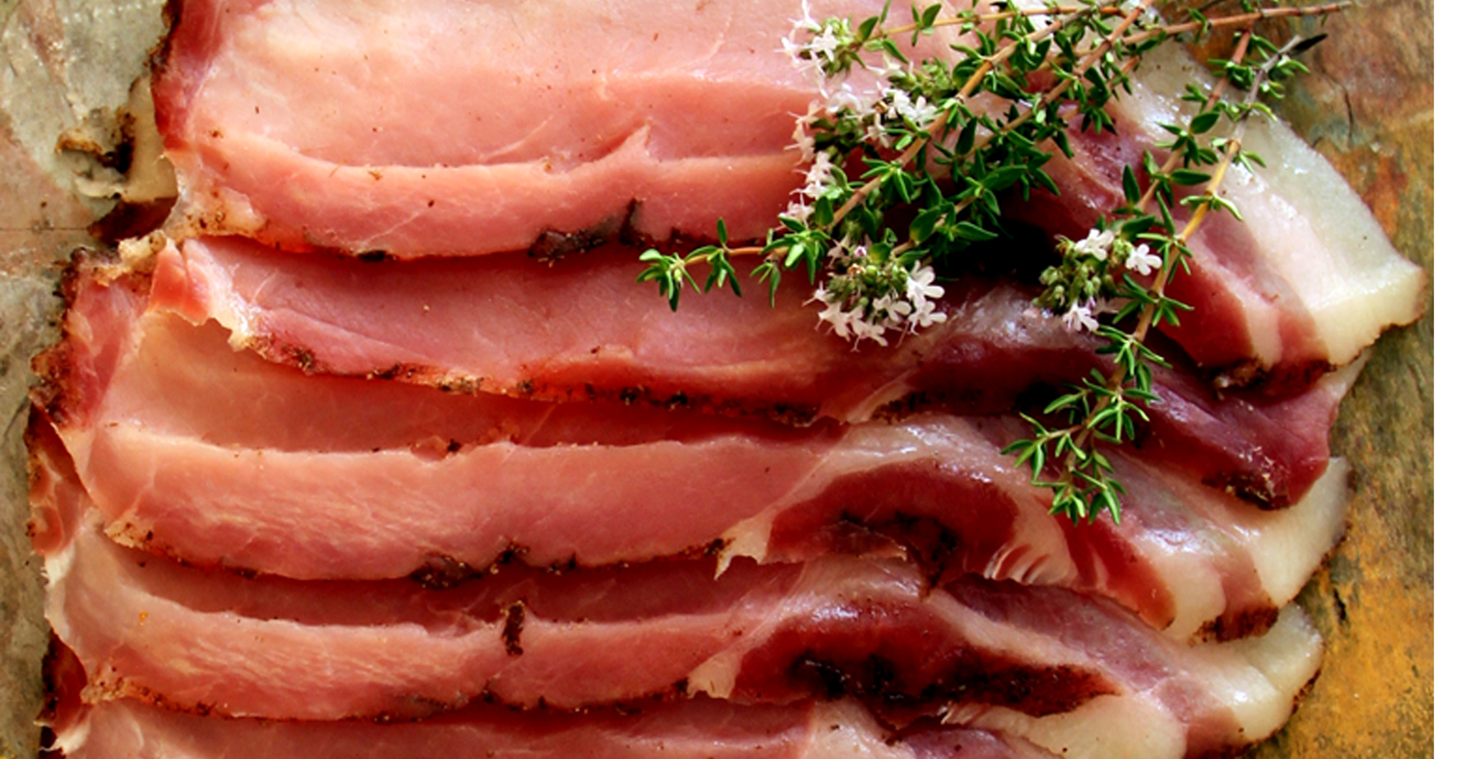 Sliced bacon with herbs