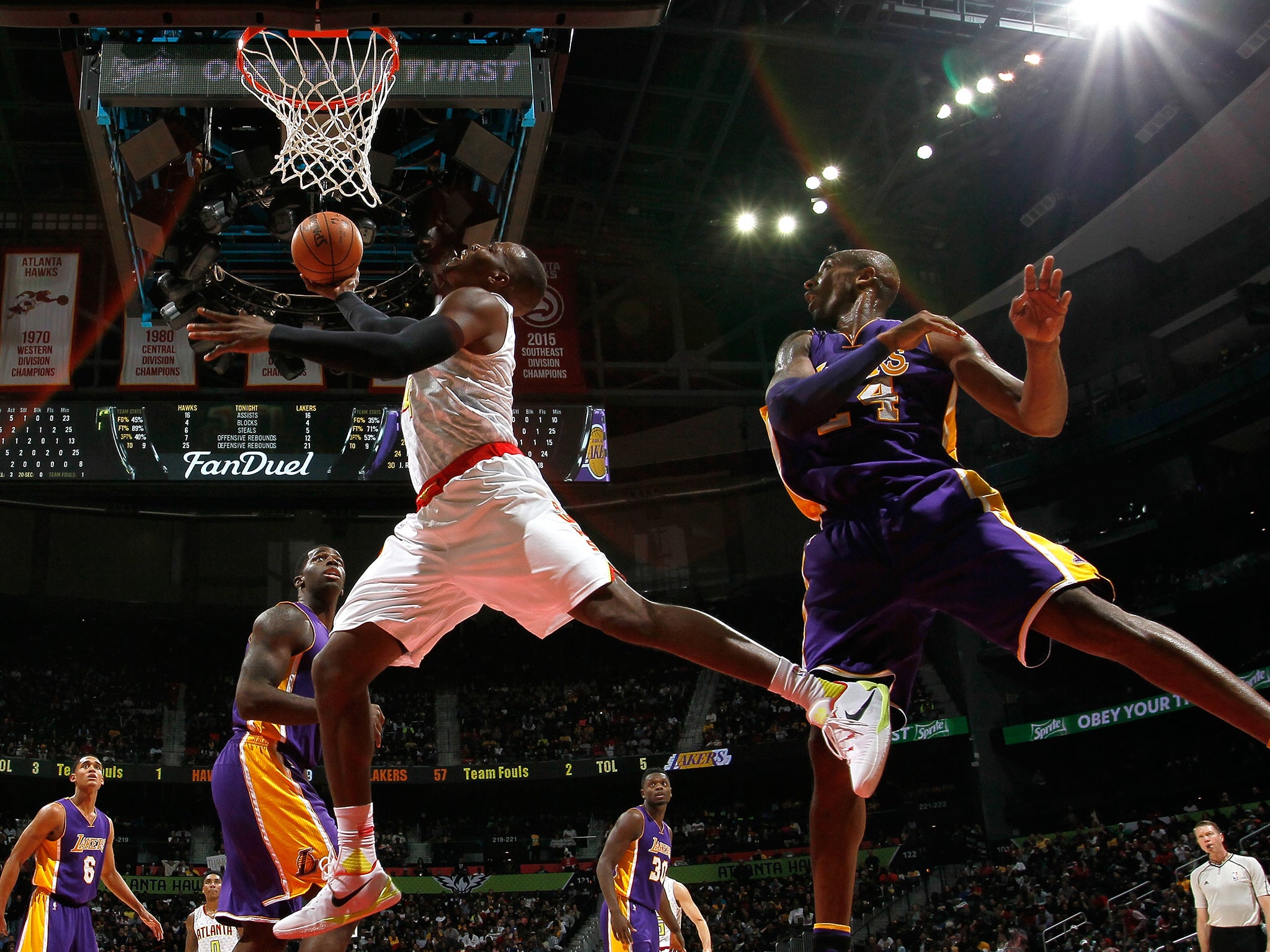 &#13;
Paul Millsap lays in a basket&#13;