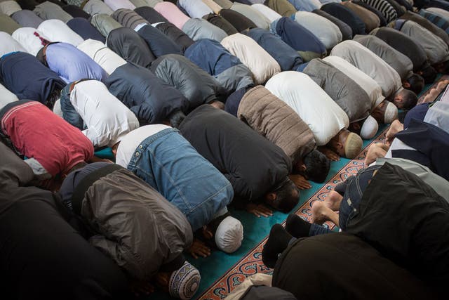 Men attend the first Friday prayers of Ramadan in East London, 2015
