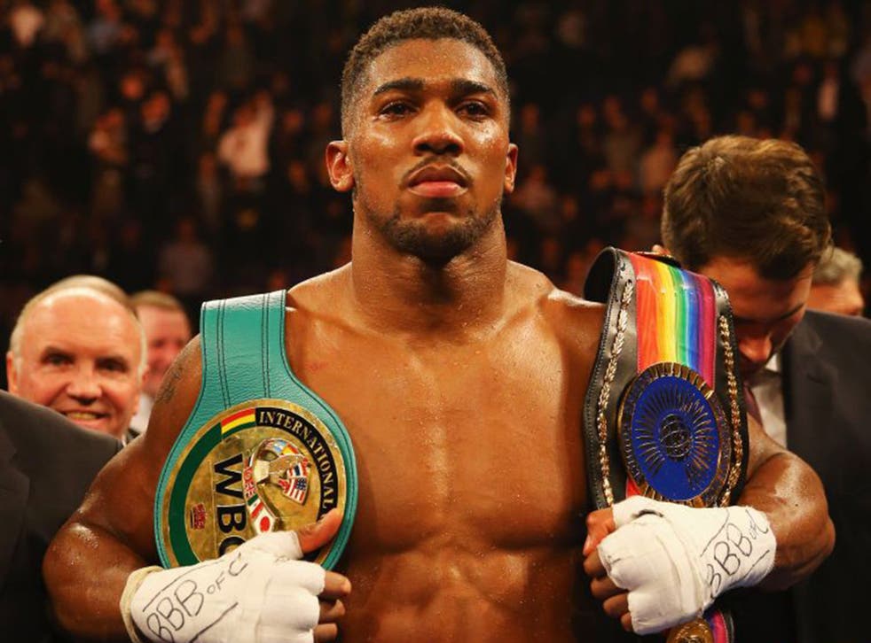 Anthony Joshua celebrates victory over Dillian Whyte after the British and Commonwealth heavyweight title contest in December 2015