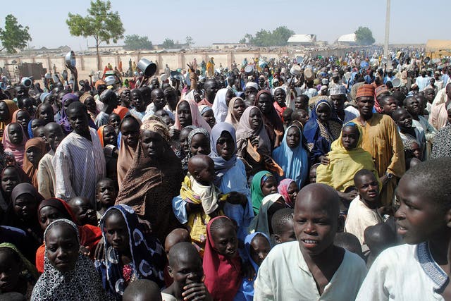 Internally Displaced Persons (IDP) mostly women and children stand waiting for food at Dikwa Camp, in Borno State in north-eastern Nigeria, on 2 February, 2016
