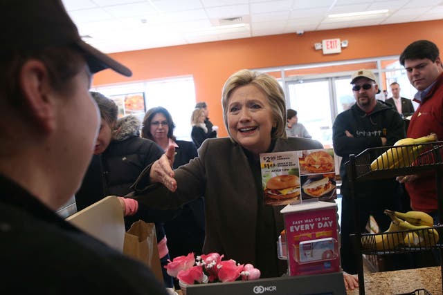 Ms Clinton eats what the people eat - iced coffee and donuts