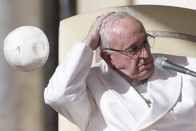 Pope Francis, here losing his skullcap in Saint Peter’s Square, visits Latin America later this week