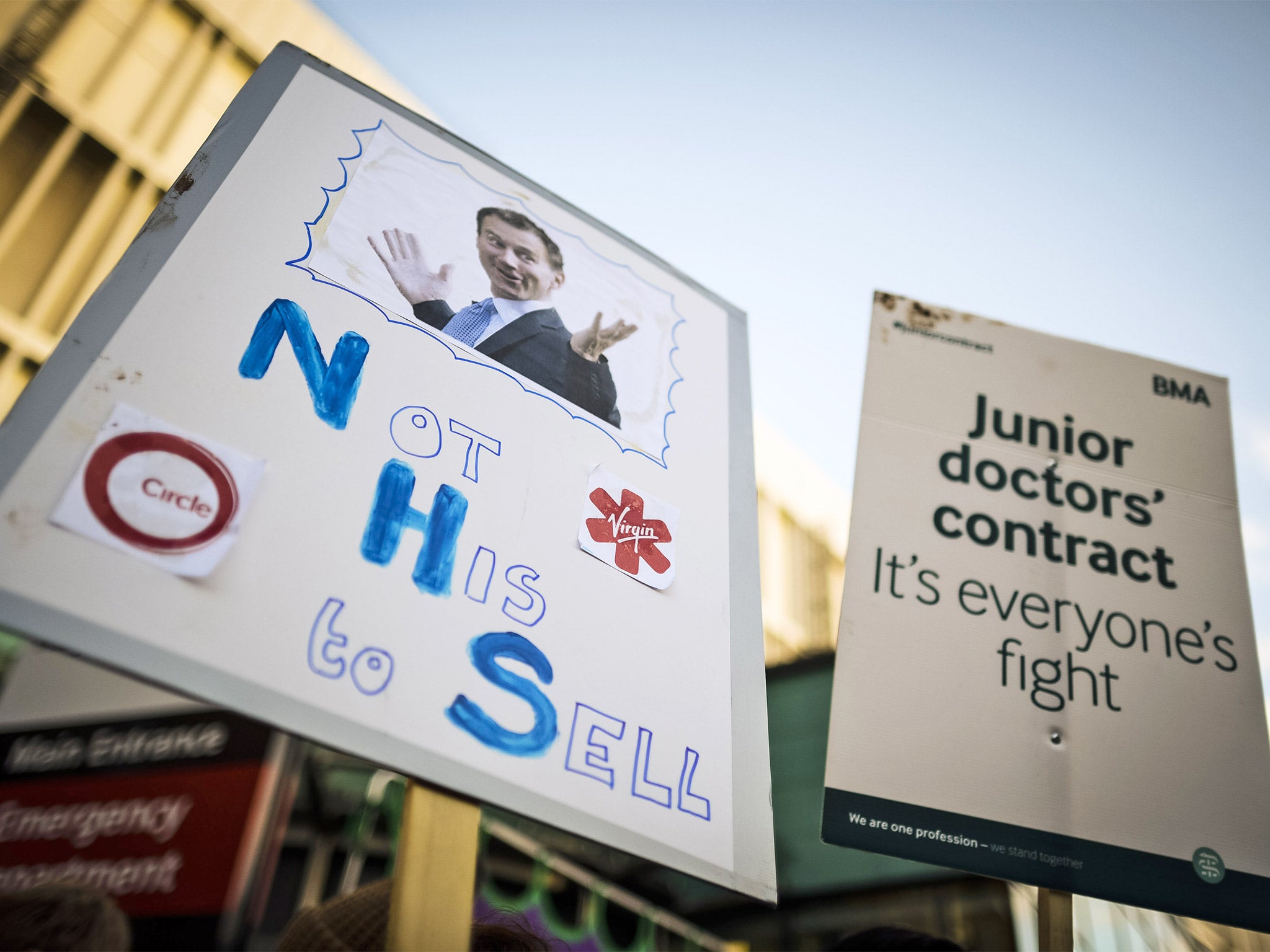 A placard depicting Jeremy Hunt is held up at the picket line outside the Bristol Royal Infirmary