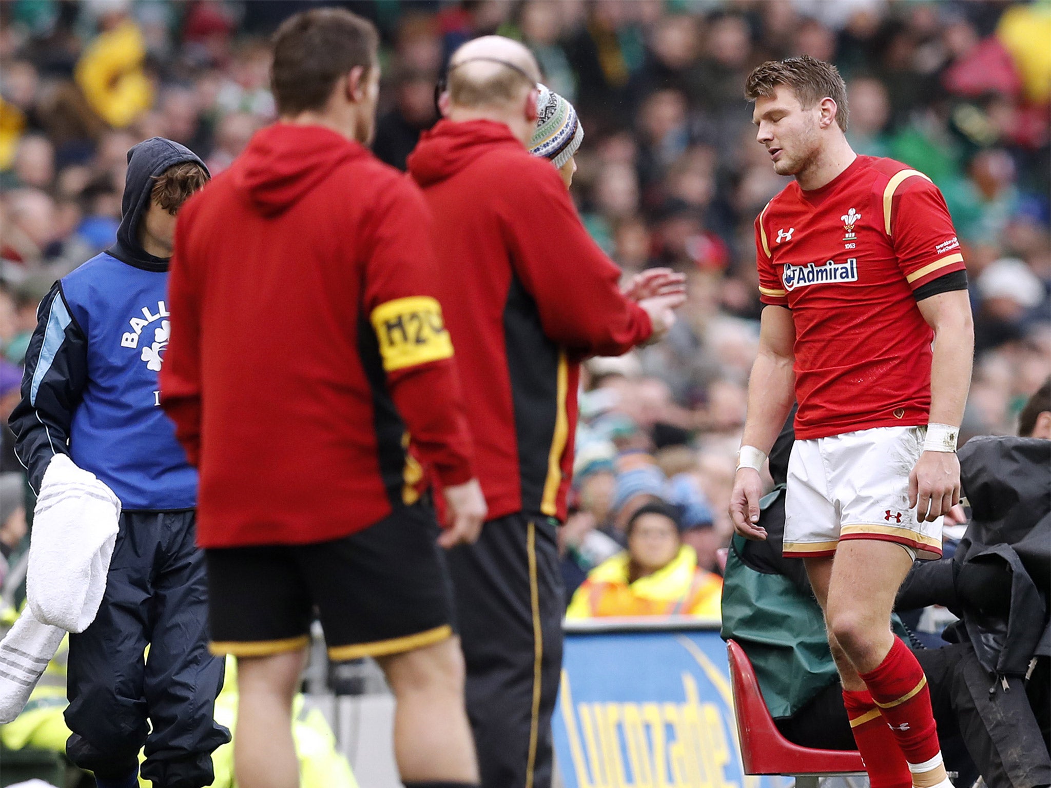 Wales fly-half Dan Biggar is helped from the field after spraining his ankle against Ireland during the 16-16 draw in Dublin