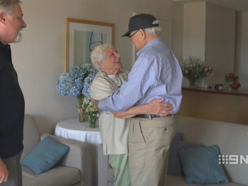 Wartime sweethearts Norwood Thomas, 93, and Joyce Morris, 88, embrace for the first time since 1944