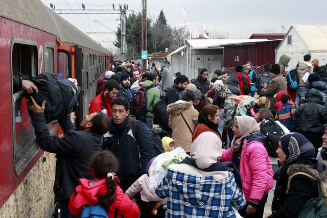 Refugees arrive by train at the transit center for refugees near northern Macedonian village of Tabanovce, before continuing their journey to Serbia