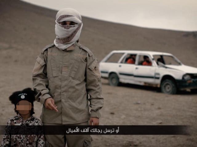 Isa Dare and an unidentified Isis militant believed to be a British teenager in a propaganda video released in February 2016