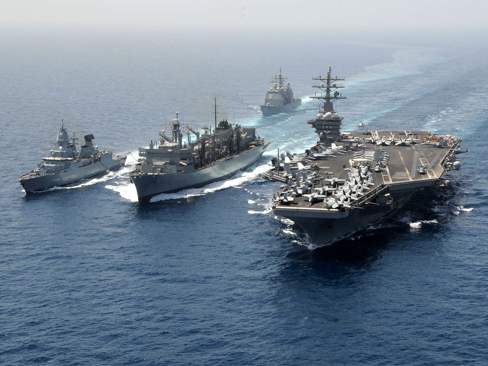 The former flagship of Standing Nato Maritime Group 2, FGS Hamburg (far left), refuelling from from USNS Bridge with USS Dwight D Eisenhower on the right