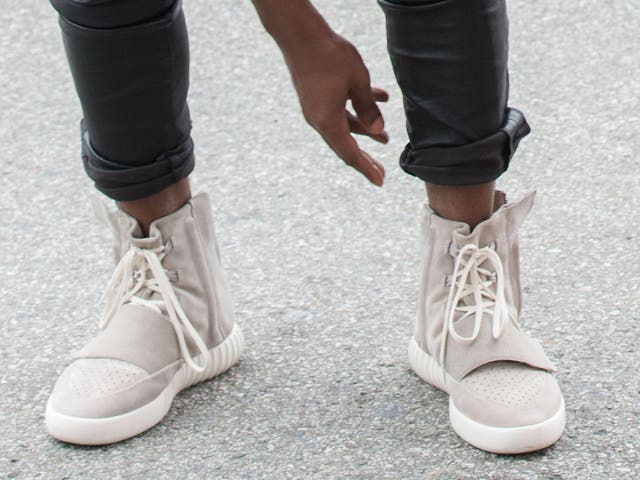 Kanye West, speculated to be wearing the Yeezy 3 sneakers 'Yeezy 750 Boost'