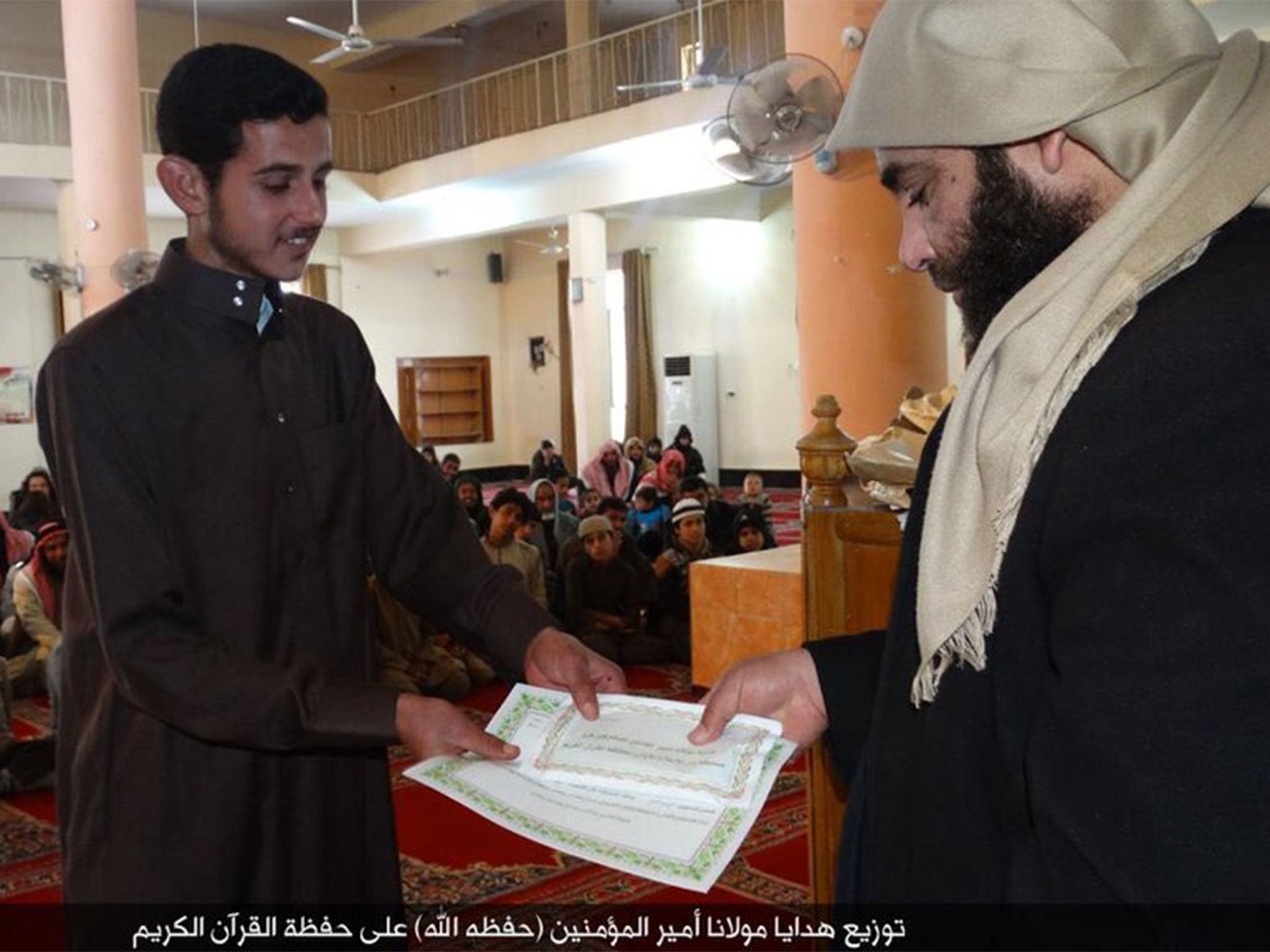 The undated images claim to show Al-Baghdadi addressing a mosque