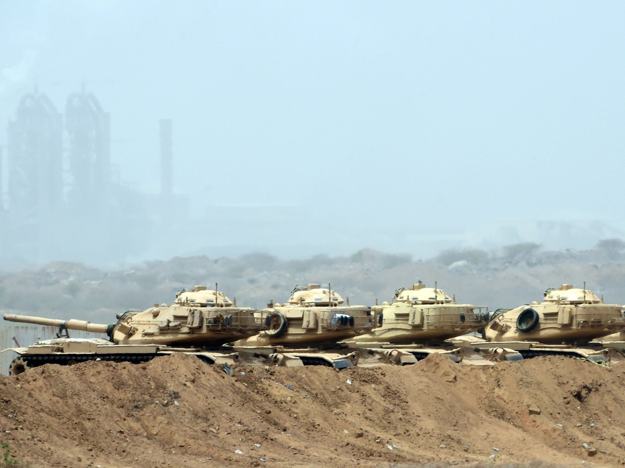 Saudi army tanks are seen deployed near the Saudi-Yemeni border, in southwestern Saudi Arabia, on 9 April, 2015