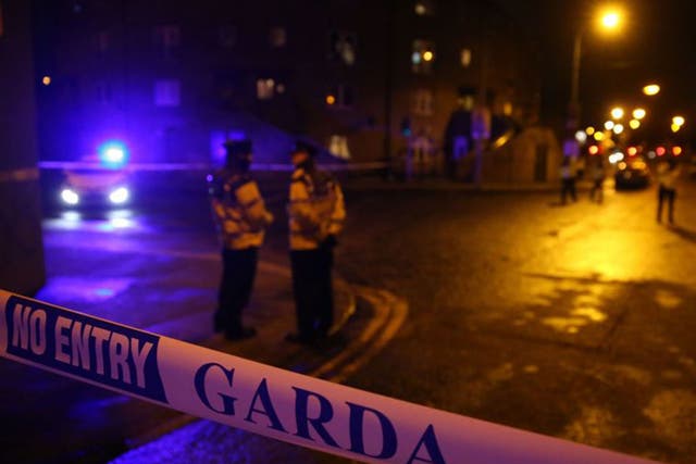 Garda officers attend the scene following the shooting of a second man in Dublin earlier this week