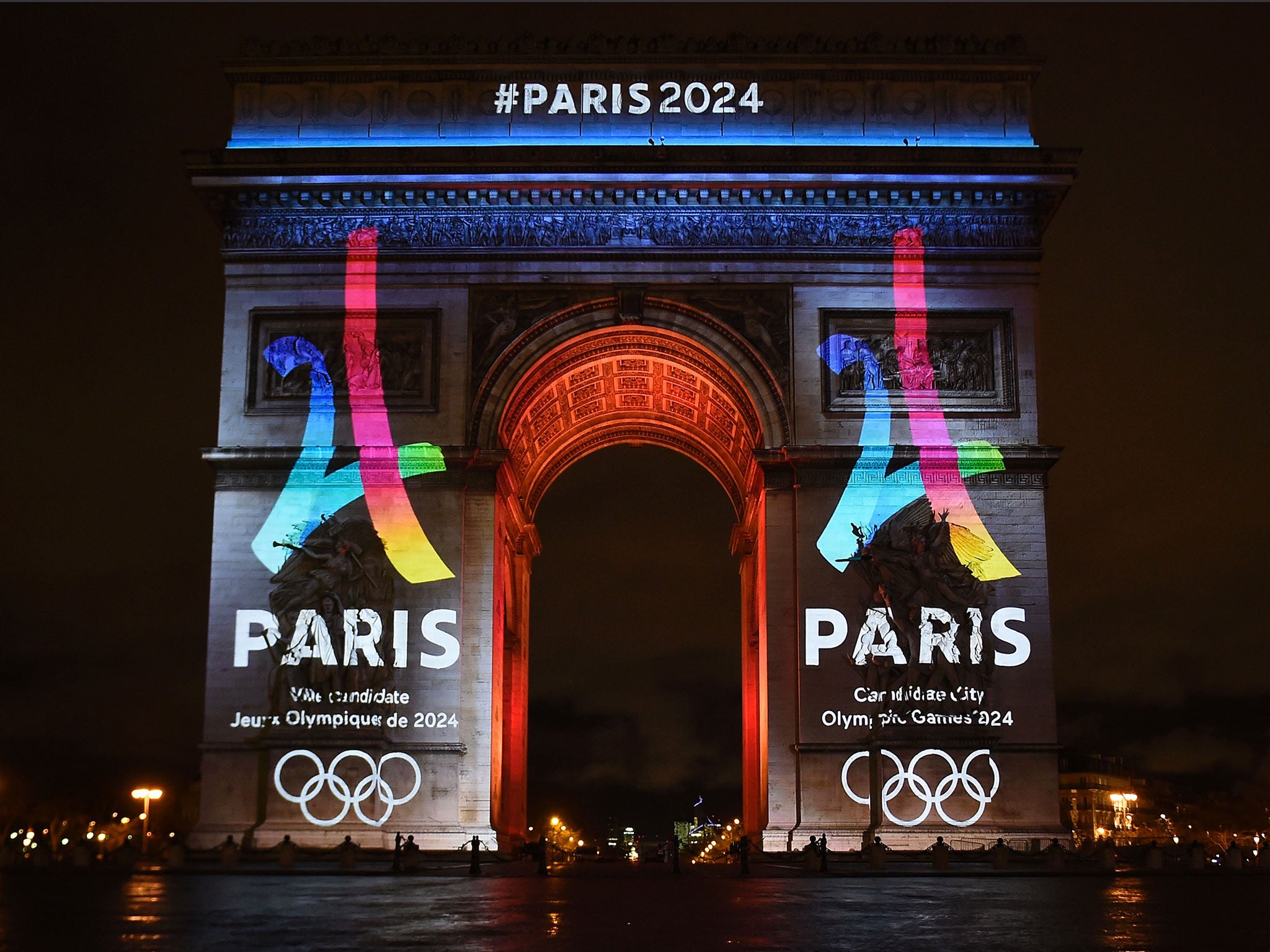 The campaign's official logo of the Paris bid to host the 2024 Olympic Games is seen on the Arc de Triomphe in Paris
