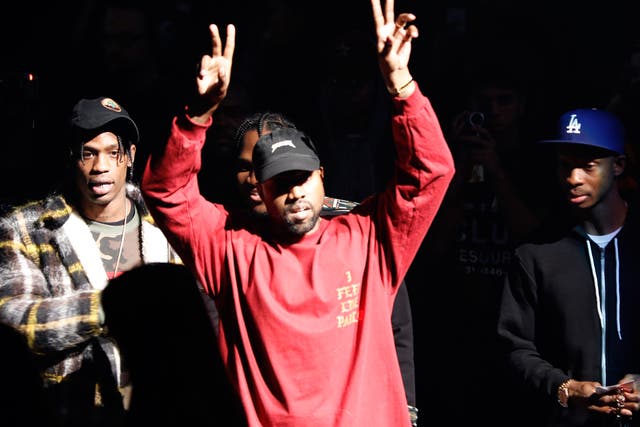 Kanye West gestures to the audience at the unveiling of the Yeezy collection and album release for his latest album, "The Life of Pablo," Thursday at Madison Square Garden in New York