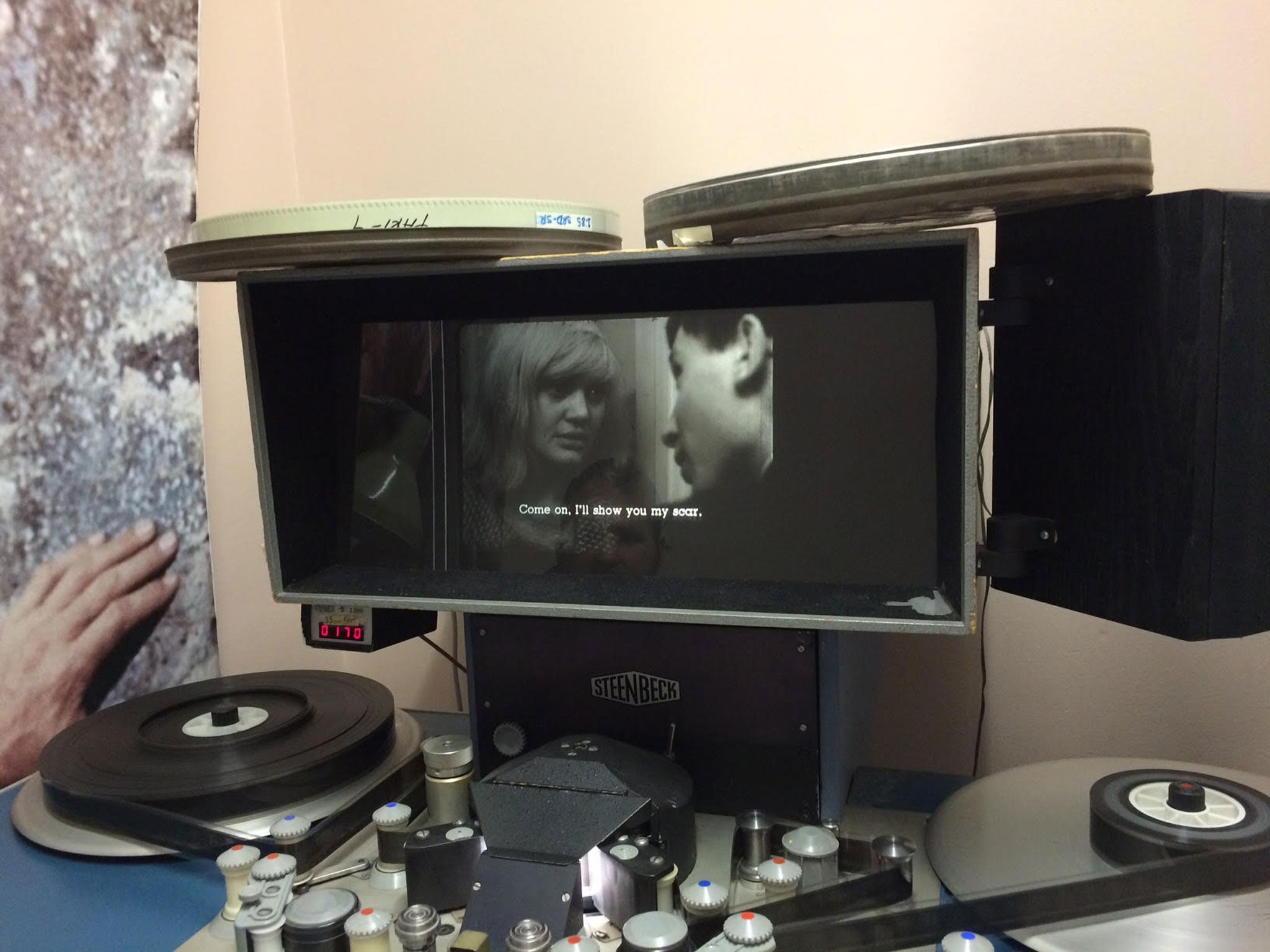 A 35mm film of Loves of a Blonde being viewed on a Steenbeck editing suite by the Overnight festival curators