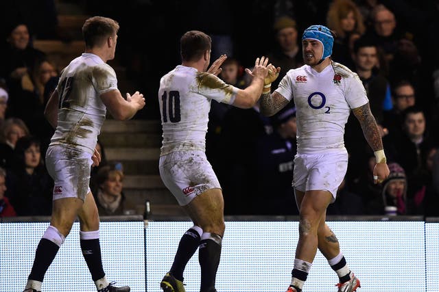 Jack Nowell celebrates his try with George Ford and Owen Farrell