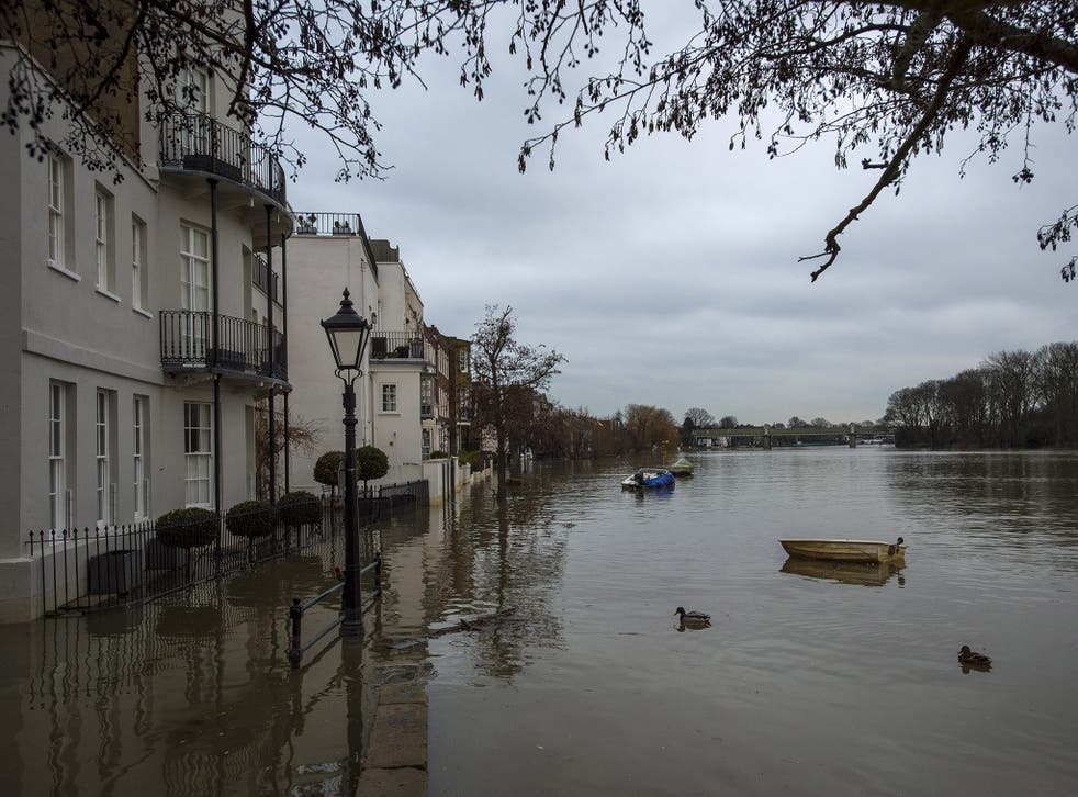 The River Thames bursts it's banks near Kew Bridge on February 12, 2016 in London, England.