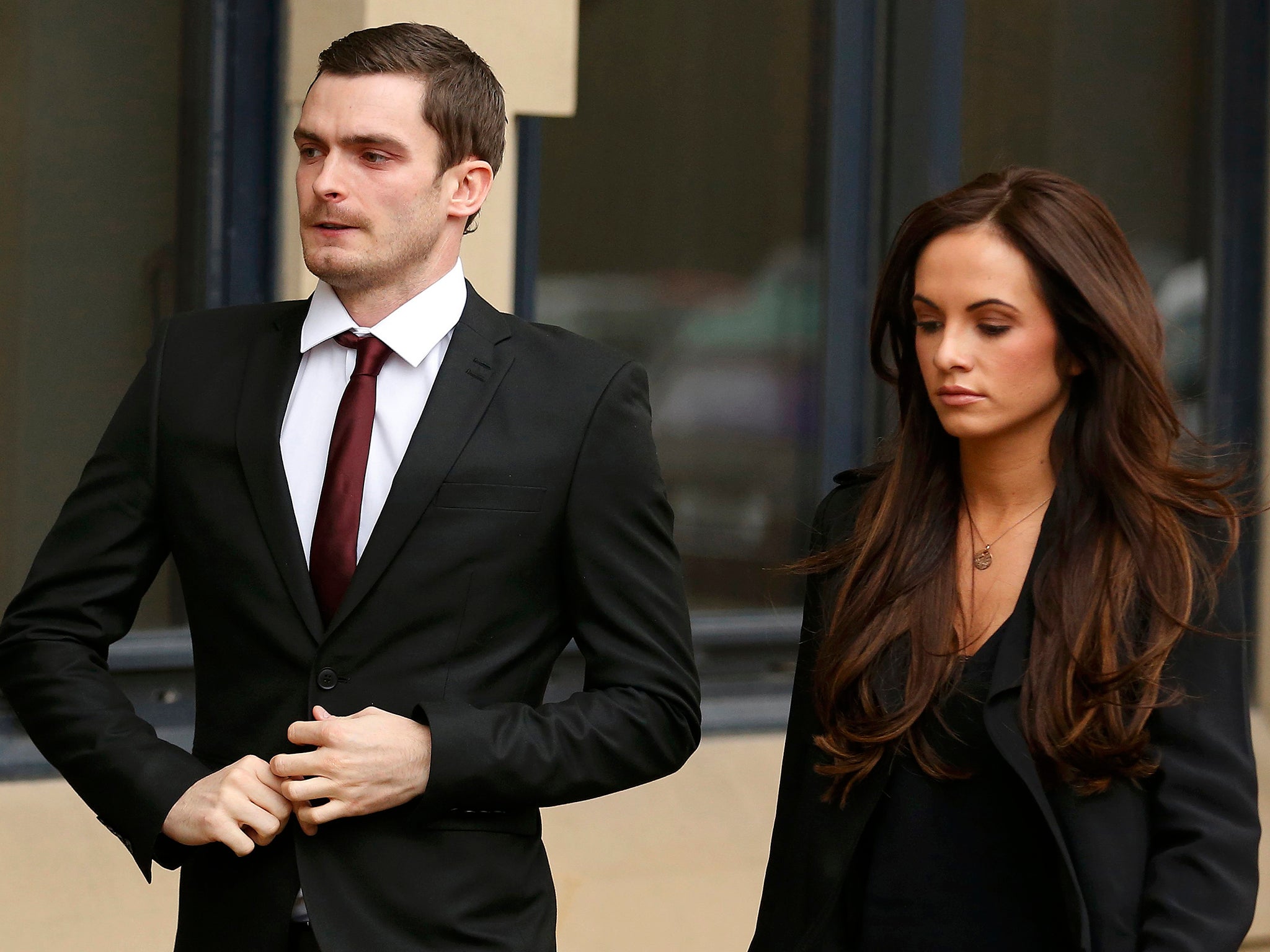Former Sunderland soccer player Adam Johnson arrives with his girlfriend Stacey Flounders at Bradford Crown Court in Bradford,