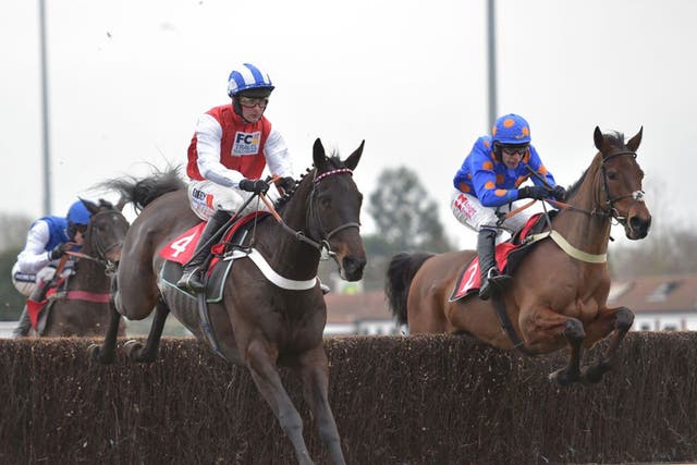 Josses Hill (left) en route to winning the graduation chase at Kempton