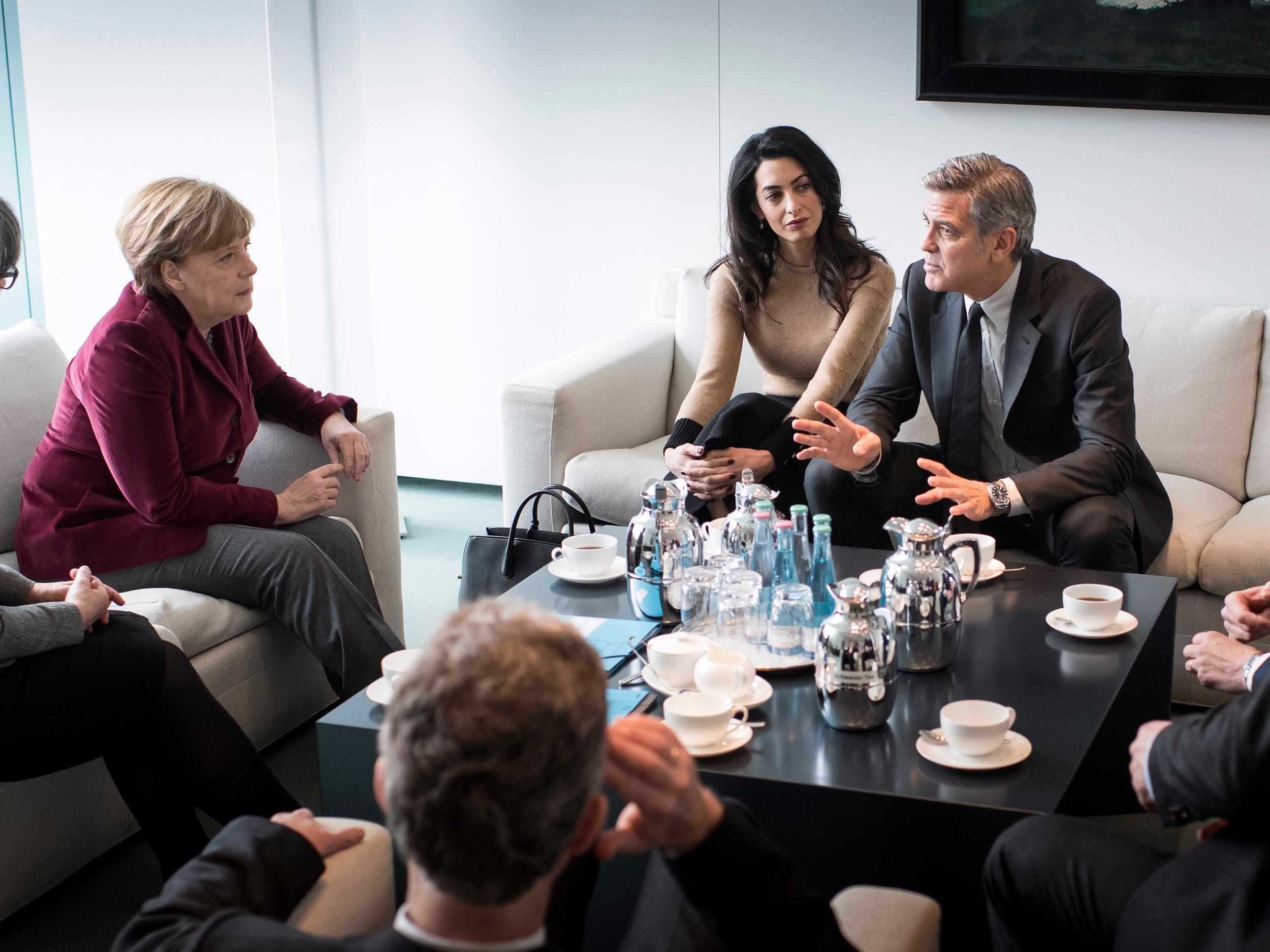 Angela Merkel meets with Amal and George Clooney at the Federal Chancellery to talk about refugee policy