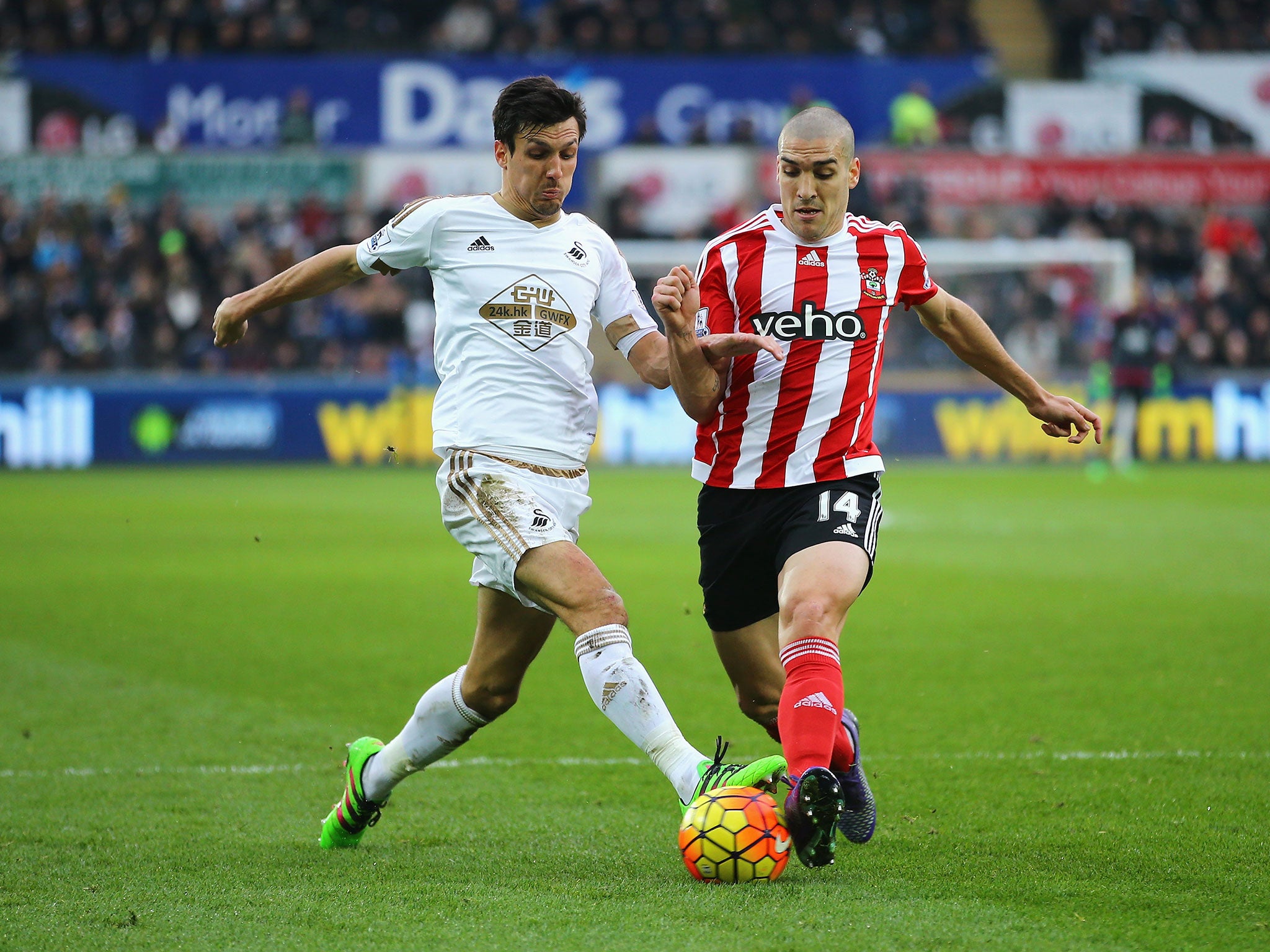 
Jack Cork and Oriol Romeu compete for the ball 