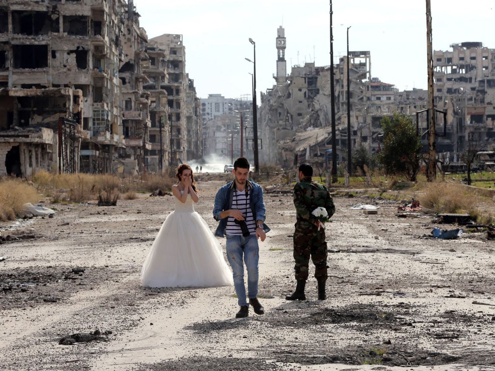 A Syrian couple preparing for their wedding photos in Homs