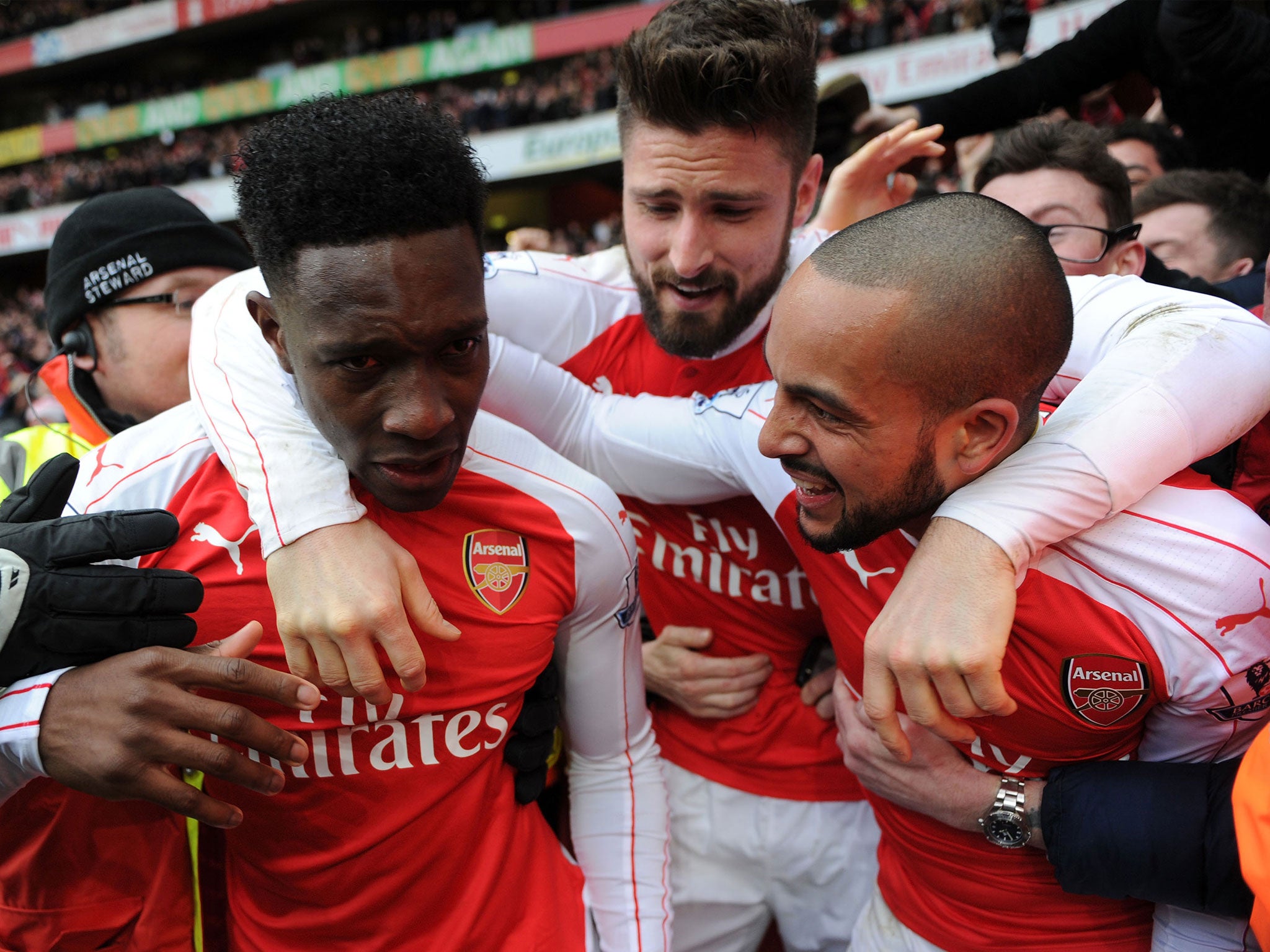 Danny Welbeck celebrates his late winner against Leicester with Theo Walcott and Olivier Giroud