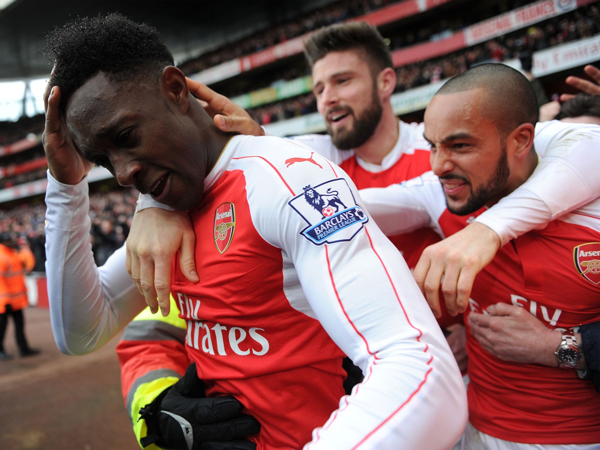 Arsenal striker Danny Welbeck is congratulated on his winning goal