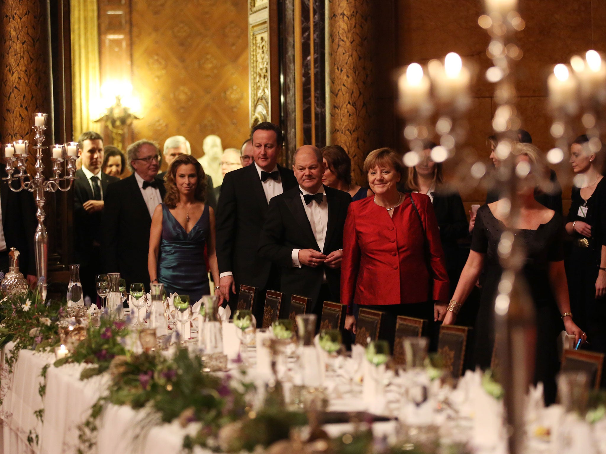 Pro-EU: David Cameron arrives with local mayor Olaf Scholz and Angela Merkel at a formal dinner in Hamburg’s city hall