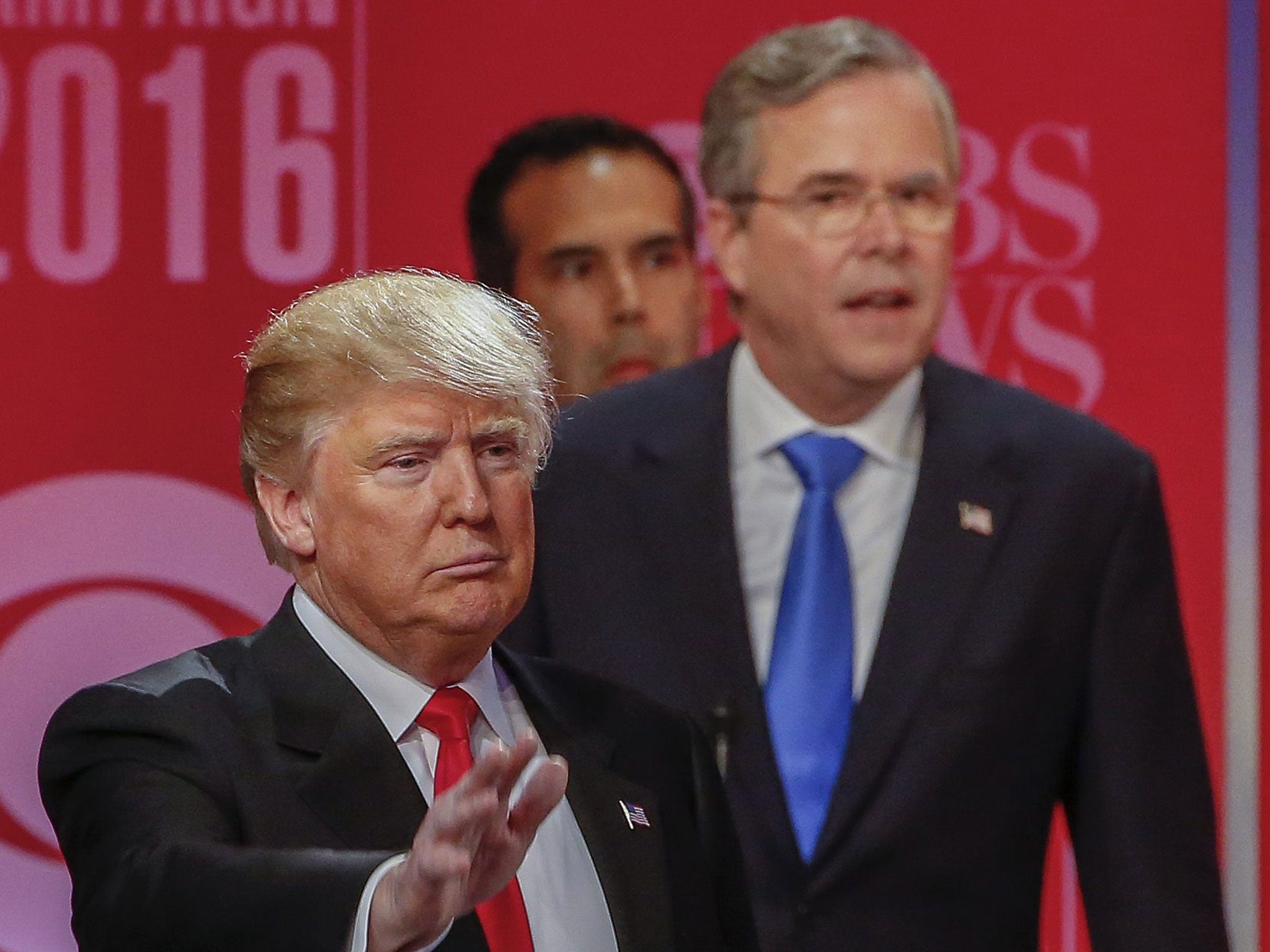 Donald Trump, left, and fellow candidate Jeb Bush speaking at the debate