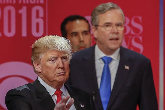 Donald Trump, left, and fellow candidate Jeb Bush speaking at the debate