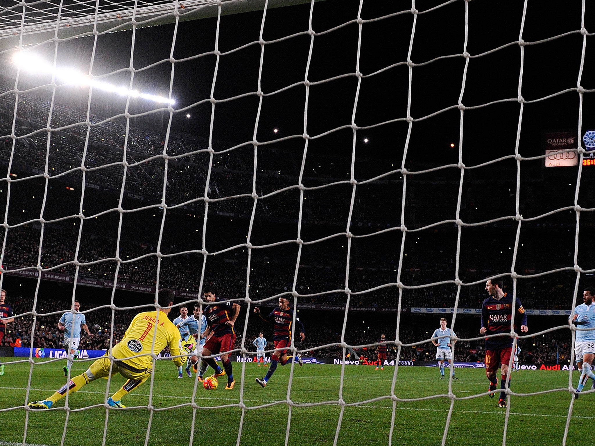 Luis Suarez completes his hat-trick after placing the ball to goalkeeper Sergio Alvarez's left