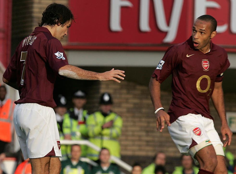 Robert Pires and Thierry Henry react after their infamous 'pass penalty' attempt in 2005