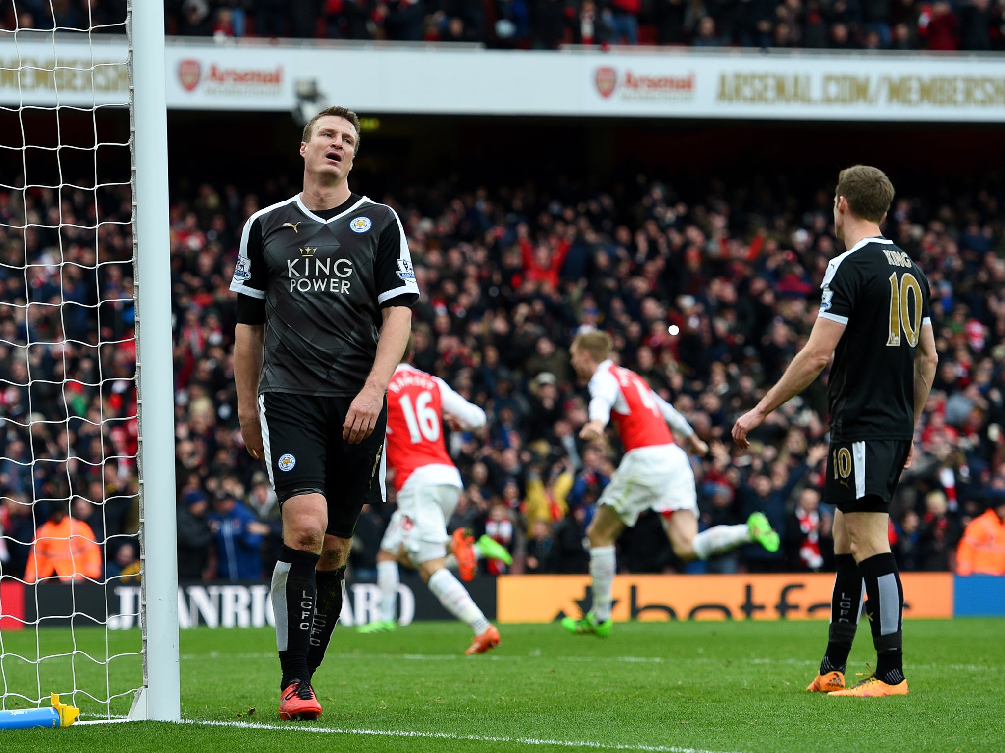 Leicester City defender Robert Huth reacts to Arsenal's late winner