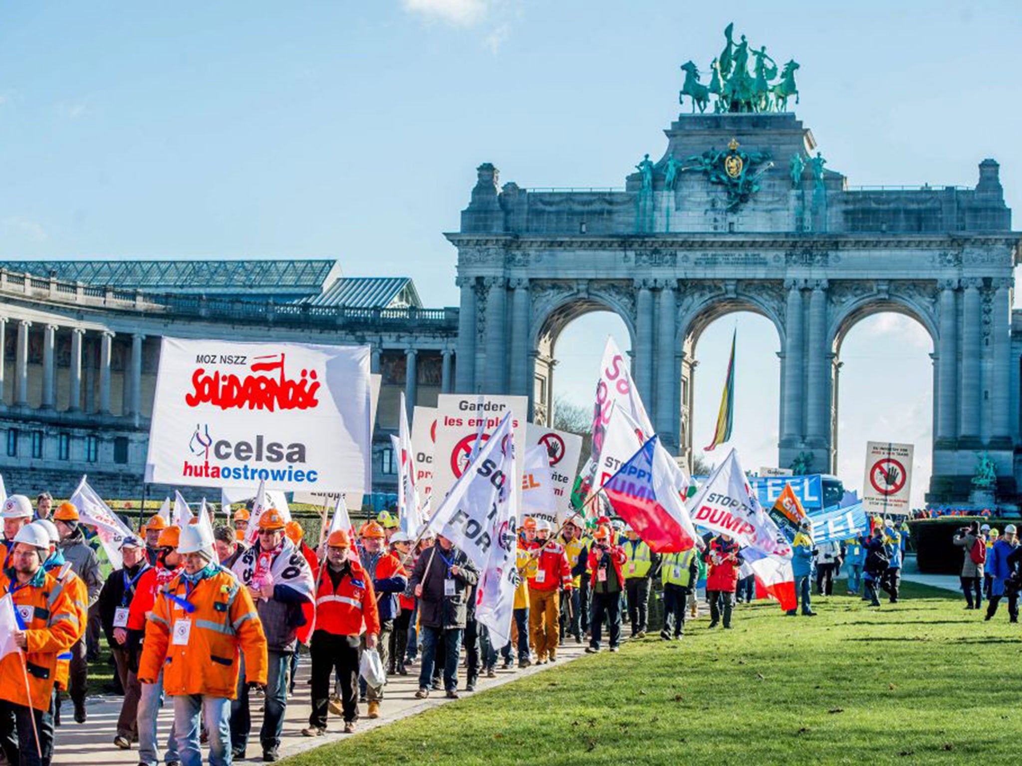 Steel workers march through the Arcade du Cinquantenair in Brussels