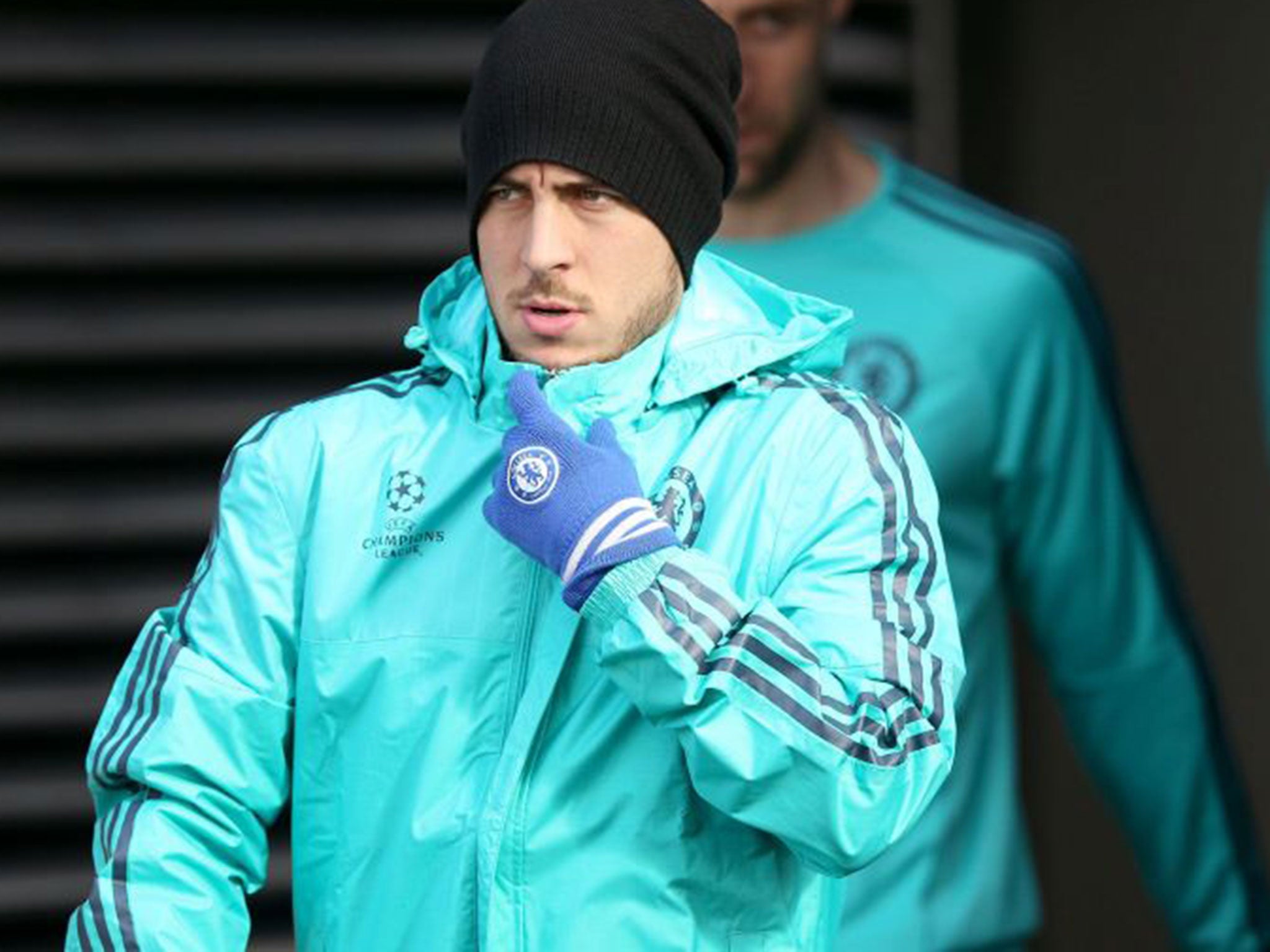 Eden Hazard is well wrapped up for training at Cobham on Monday before Chelsea flew to Paris for Tursday's Champions League tie against PSG