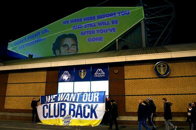 Projections and a banner, in protest against Leeds owner Massimo Cellino, are seen prior to the match at Elland Road