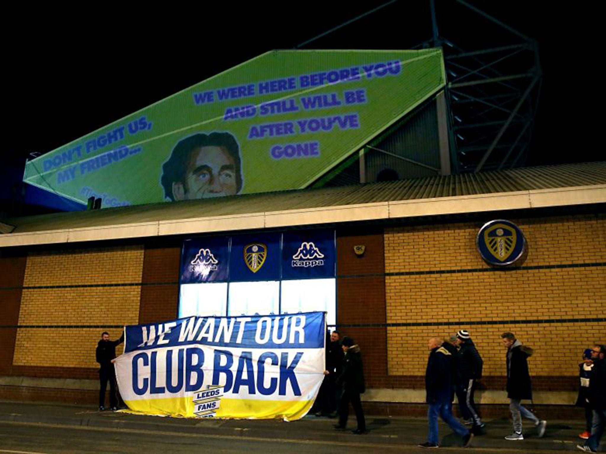 Projections and a banner, in protest against Leeds owner Massimo Cellino, are seen prior to the match at Elland Road