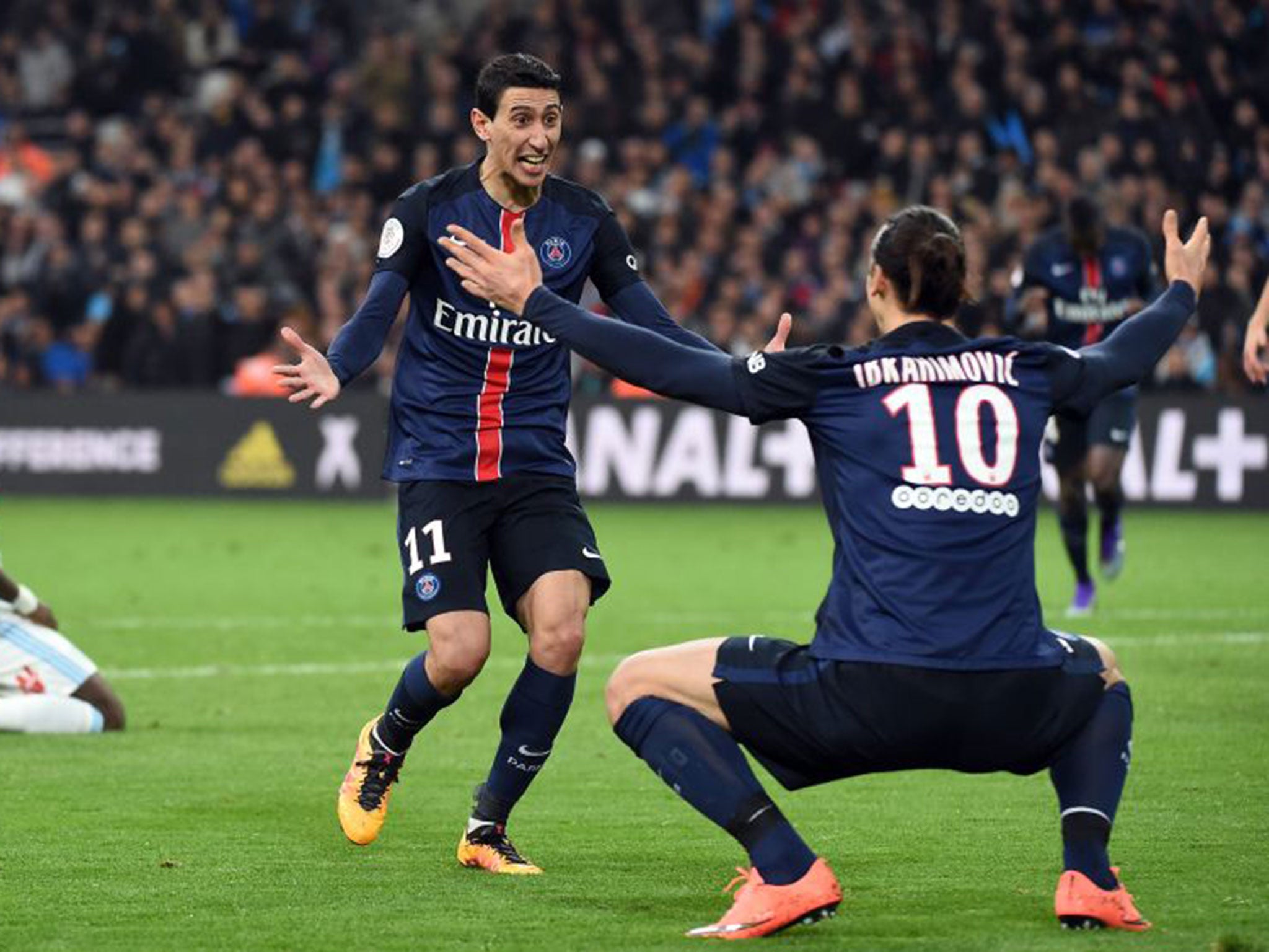 PSG’s Zlatan Ibrahimovic congratulates Angel Di Maria on scoring in a 2-1 win at Marseille, who trail their rivals by 35 points