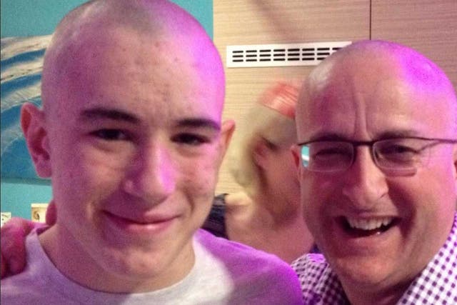 Nigel Maguire (right) claims that years of playing on synthetic football pitches caused son Lewis's cancer