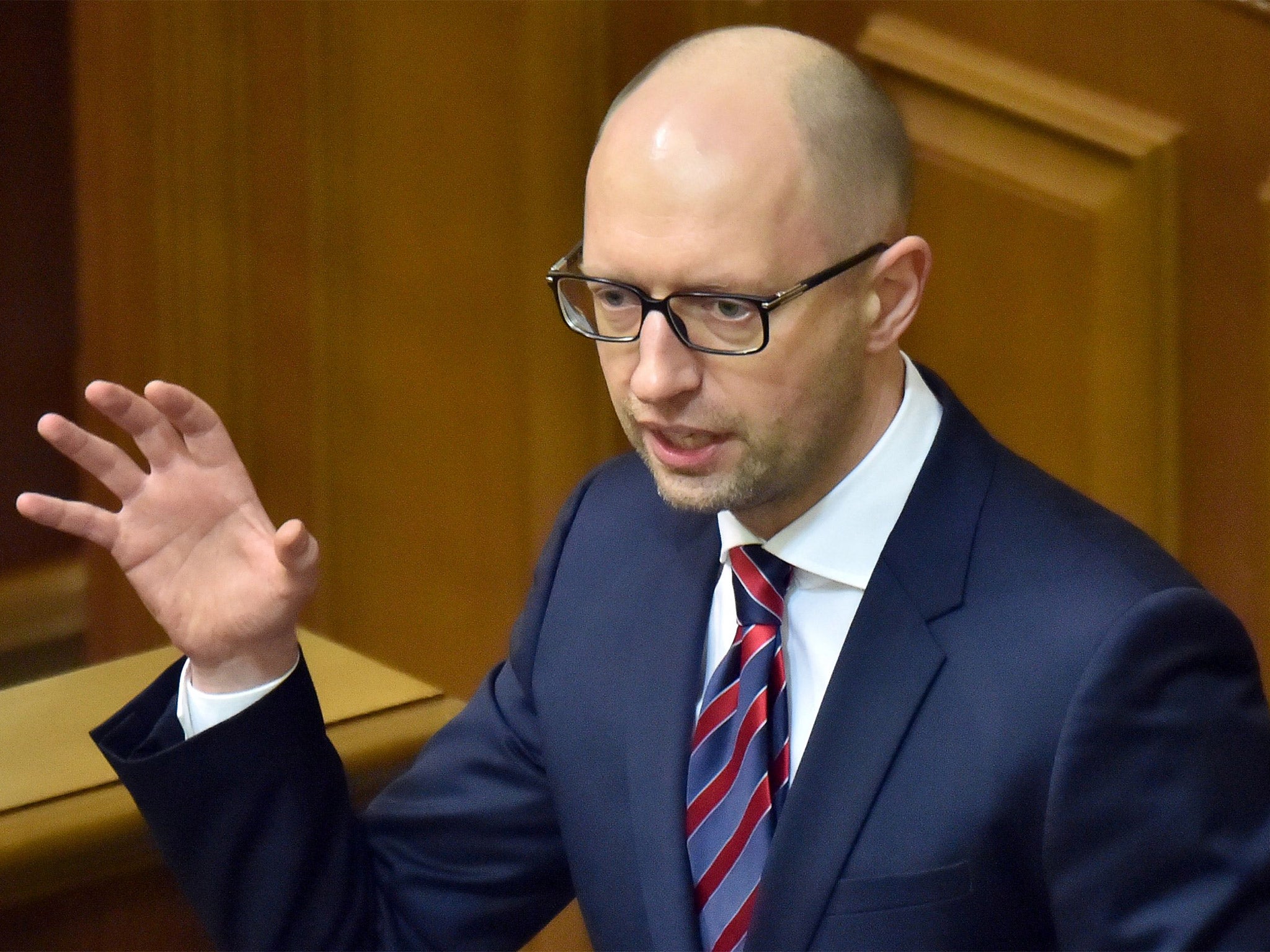 &#13;
Ukrainian Prime Minister Arseniy Yatsenyuk speaks to the parliament in Kiev (Getty)&#13;
