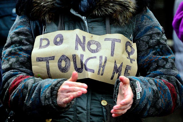 A woman protests in front of Hauptbahnhof main railway station against the New Year's Eve sex attacks on 9 January, 2016, in Cologne, Germany