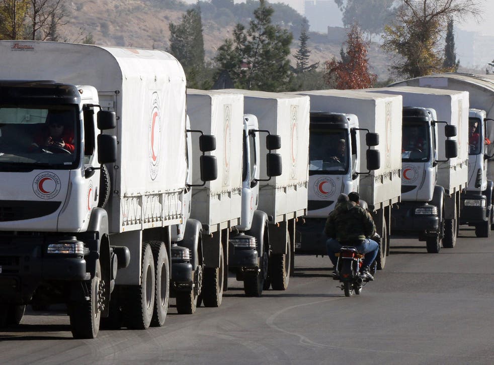 A convoy of aid from the Syrian Arab Red Crescent leaves the capital Damascus for the besieged rebel-held Syrian town of Madaya, on 14 January, 2016
