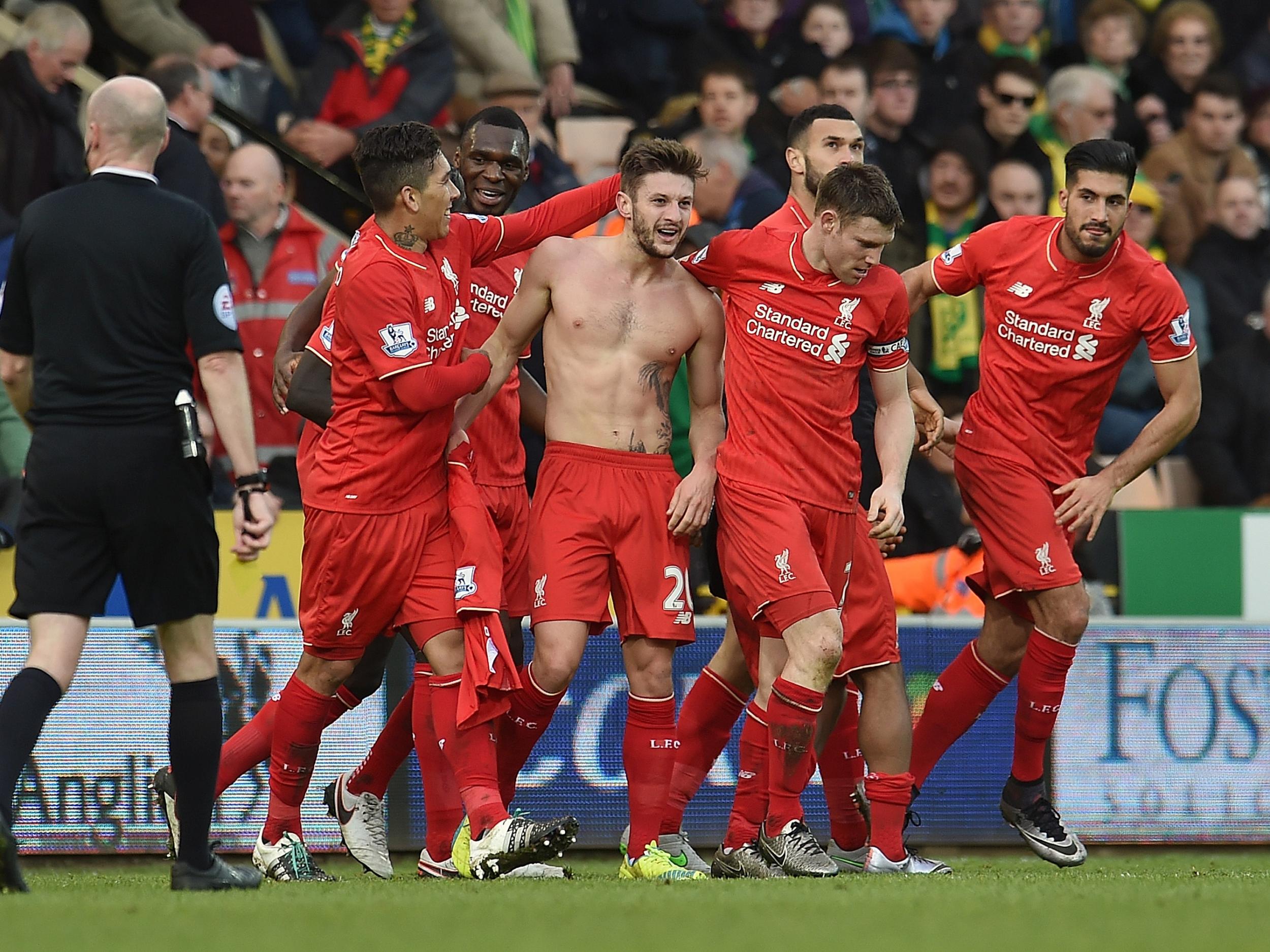 Adam Lallana celebrates for Liverpool against Norwich
