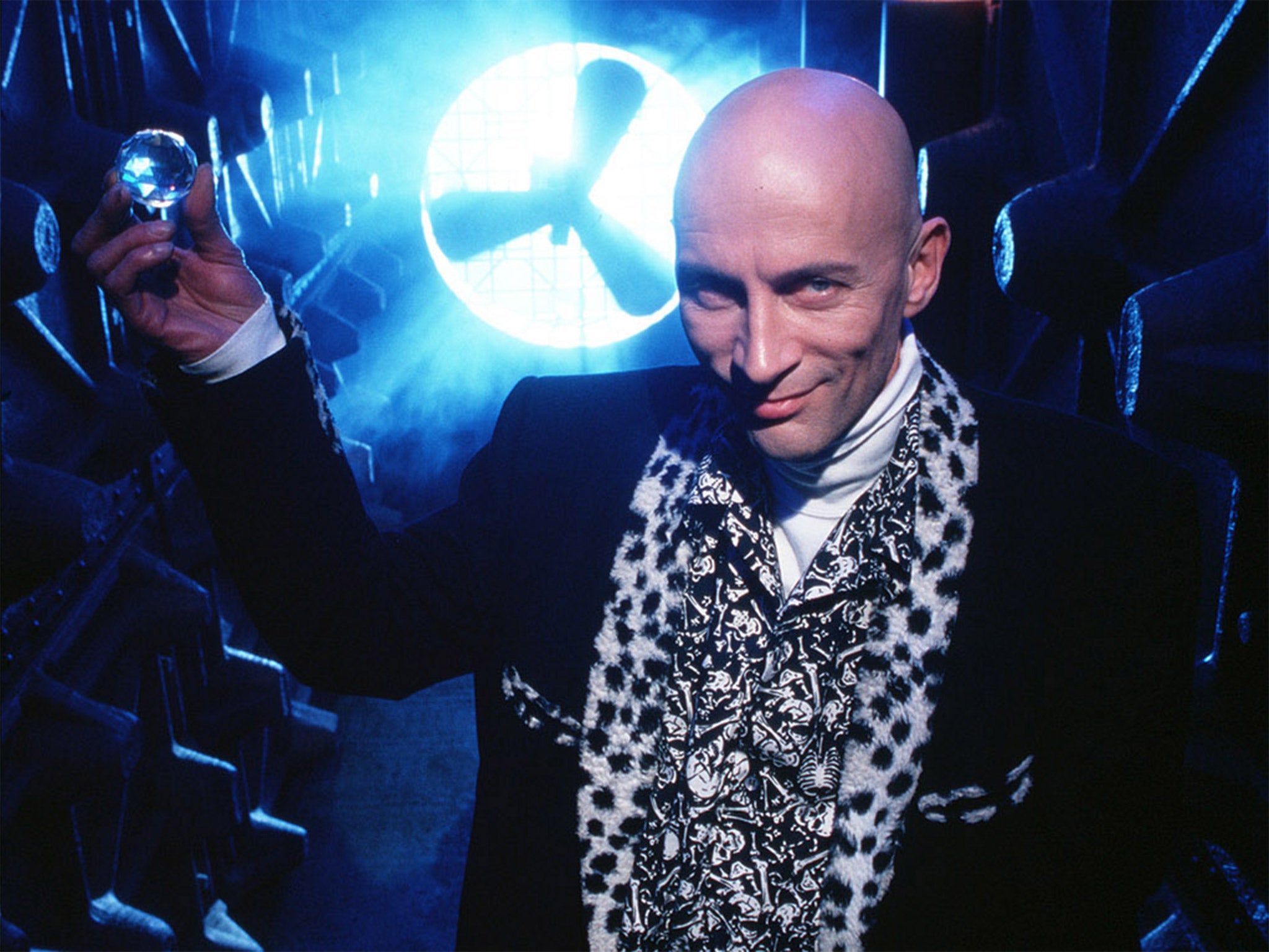 Original Crystal Maze host Richard O'Brien holds one of the coveted gems aloft
