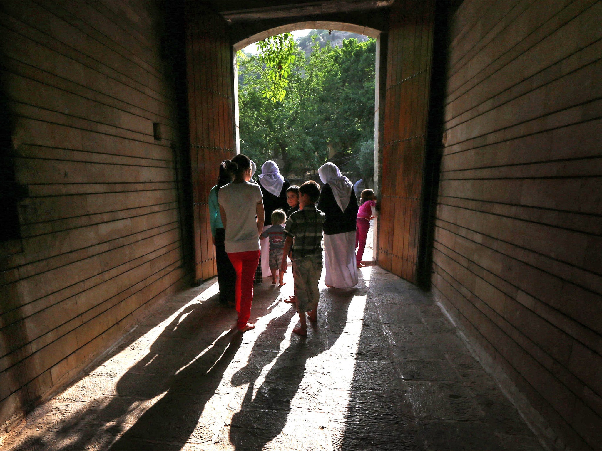 &#13;
Yazidi worshippers at a temple in Iraqi Kurdistan (Getty)&#13;