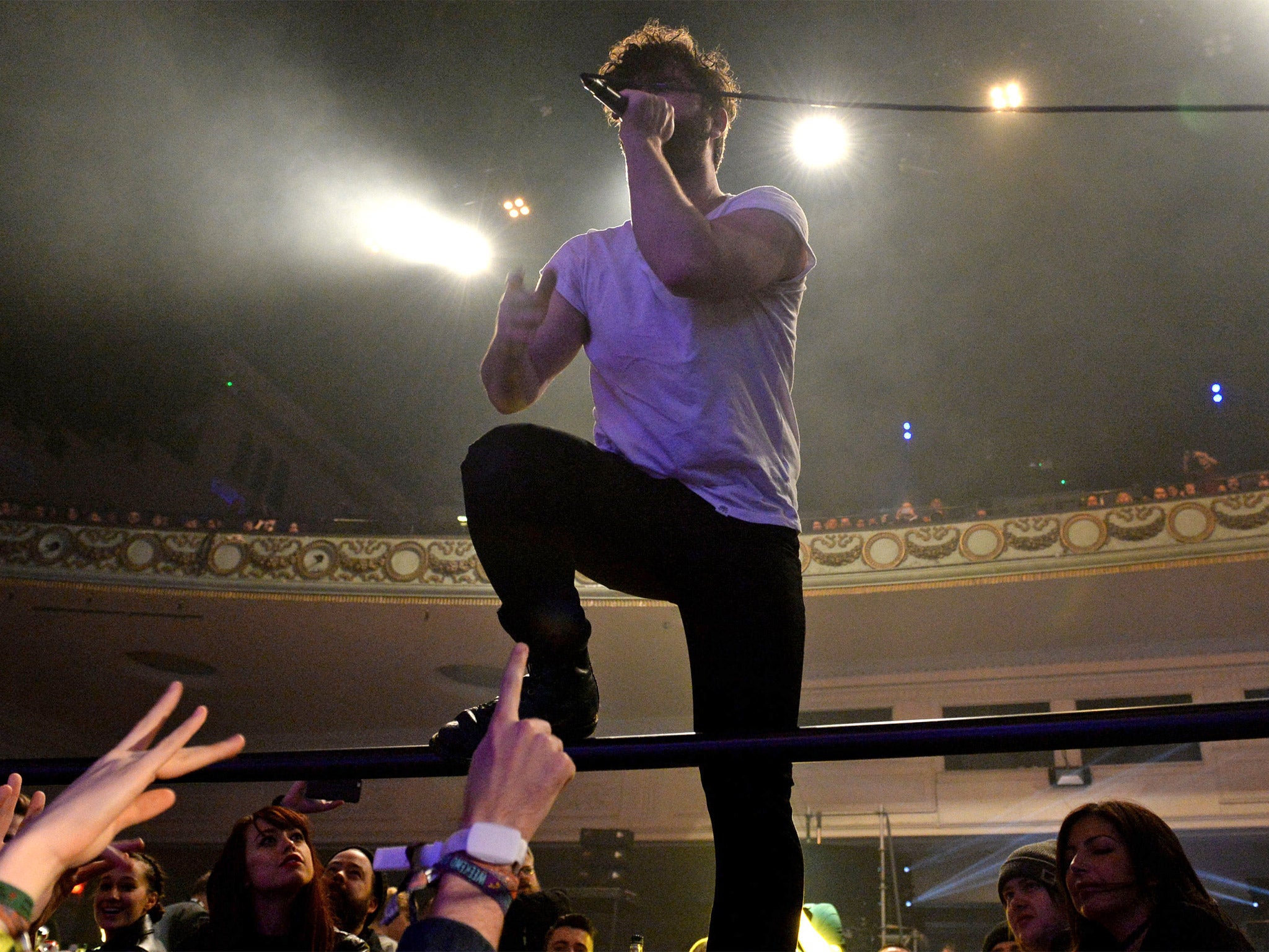 Yannis Philippakis of Foals climbed into the audience during his band's performance at the awards bash