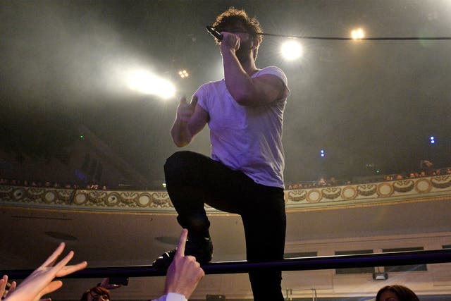 Yannis Philippakis of Foals climbed into the audience during his band's performance at the awards bash