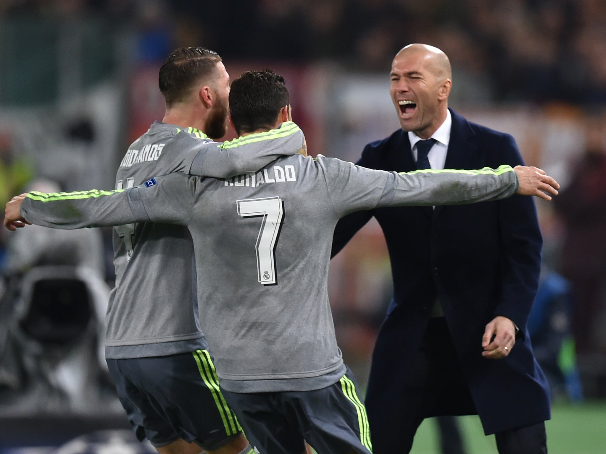 Real Madrid's Sergio Ramos and Cristiano Ronaldo celebrate with Zinedine Zidane